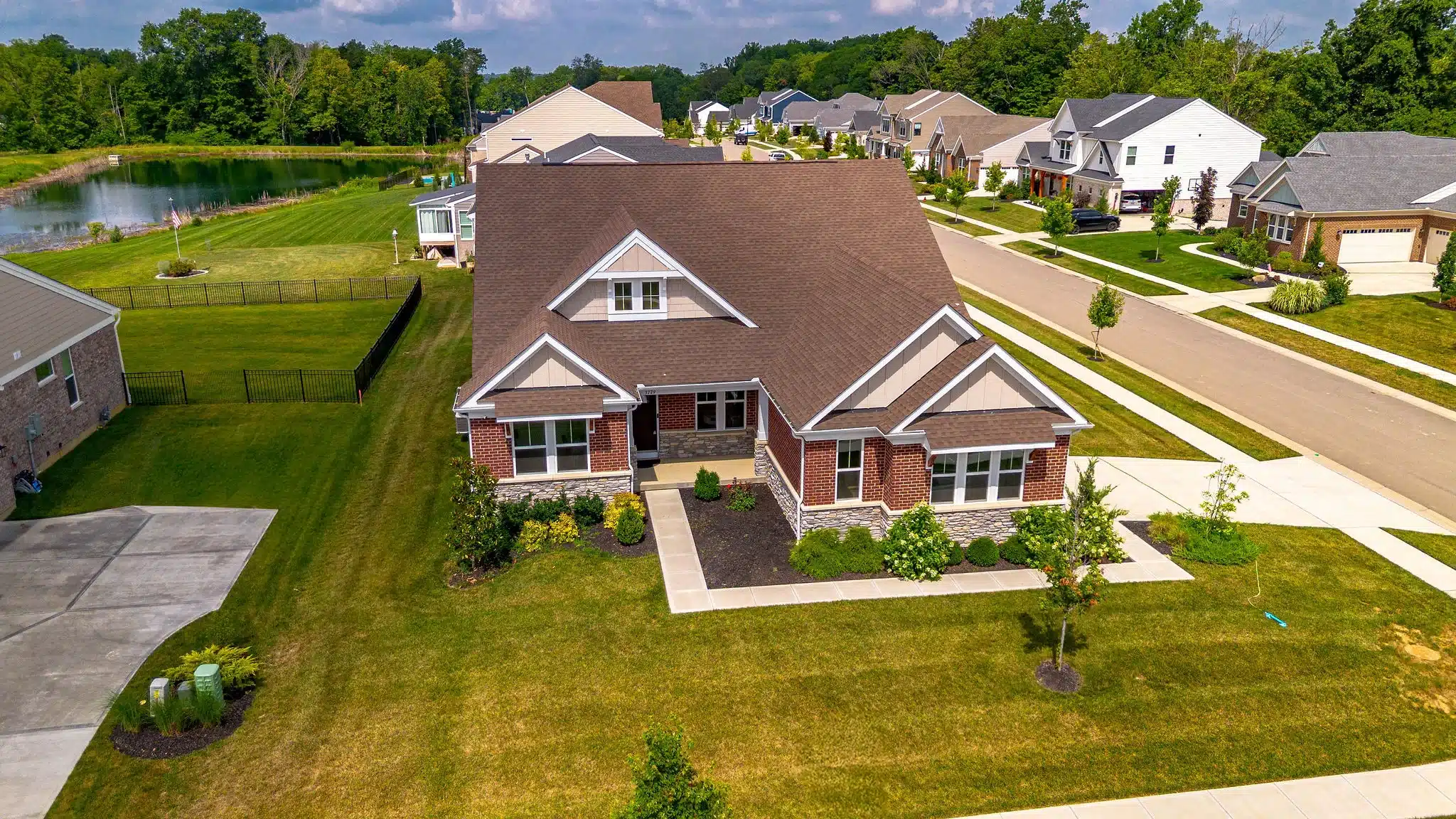 Brick-and-stone Cincinnati home exterior used as an example when discussing making an offer on a contingent or pending listing